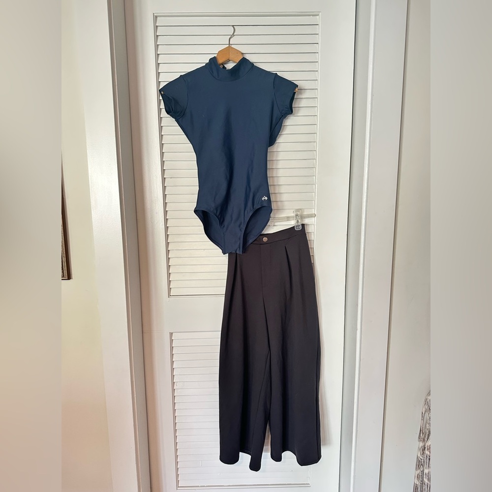 athletic material dance wear black pants and blue leotard